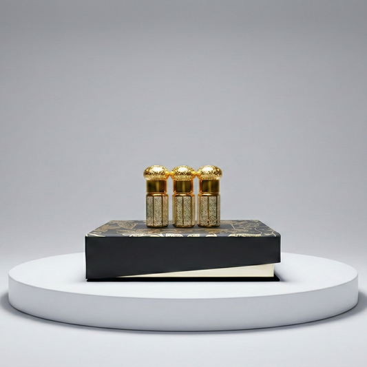 Three gold vials on a black platform with a gray background